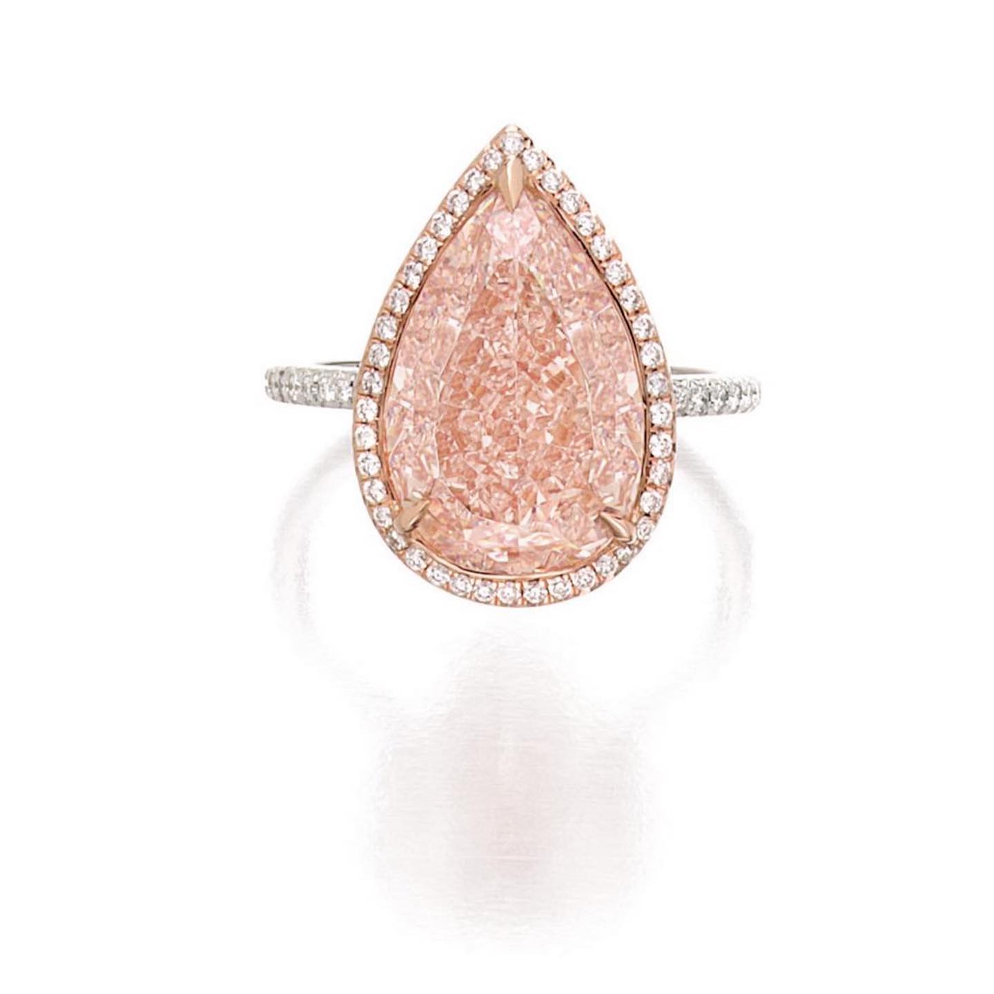 An Attractive Fancy Orangy Pink Diamond and Diamond Ring