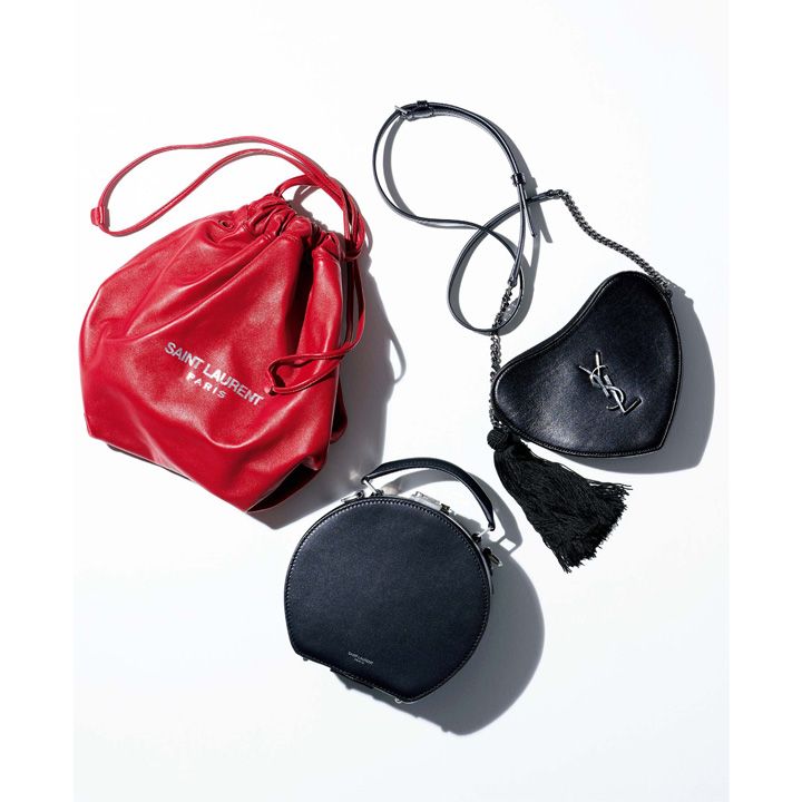 左時計回りに／ナッパレザーの巾着バッグ『テディ』［ 縦32×横22×マチ21 cm］￥145,000・バッグ『モノグラム・サンローラン クール』［縦15×横21×マチ2.5cm］￥195,000・ショルダーストラップ付きトップハンドルバッグ『ミカ』［縦19×底幅8.5×マチ8.5cm］￥295,000（イヴ・サンローラン〈サンローラン バイ アンソニー・ヴァカレロ〉）　[Precious2018年12月号263ページ] 　