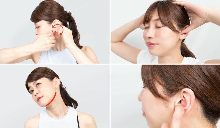 「耳のマッサージをする女性