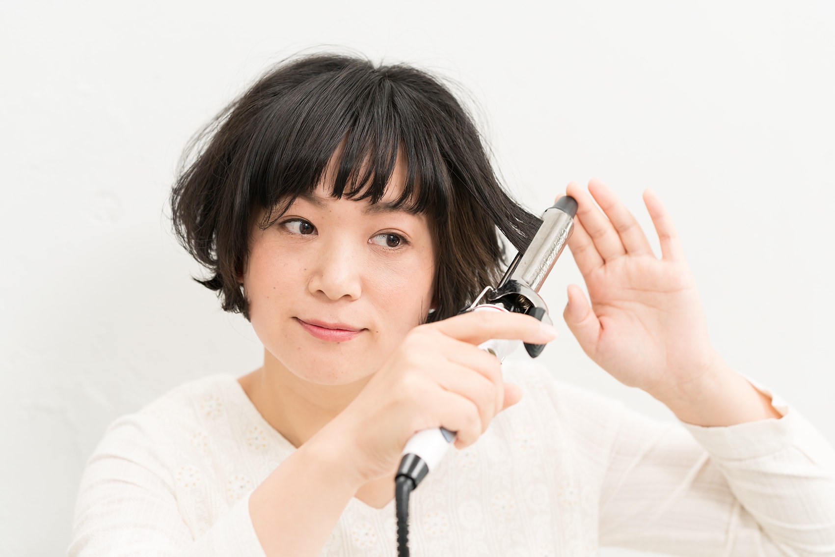 毛束をとって巻く。