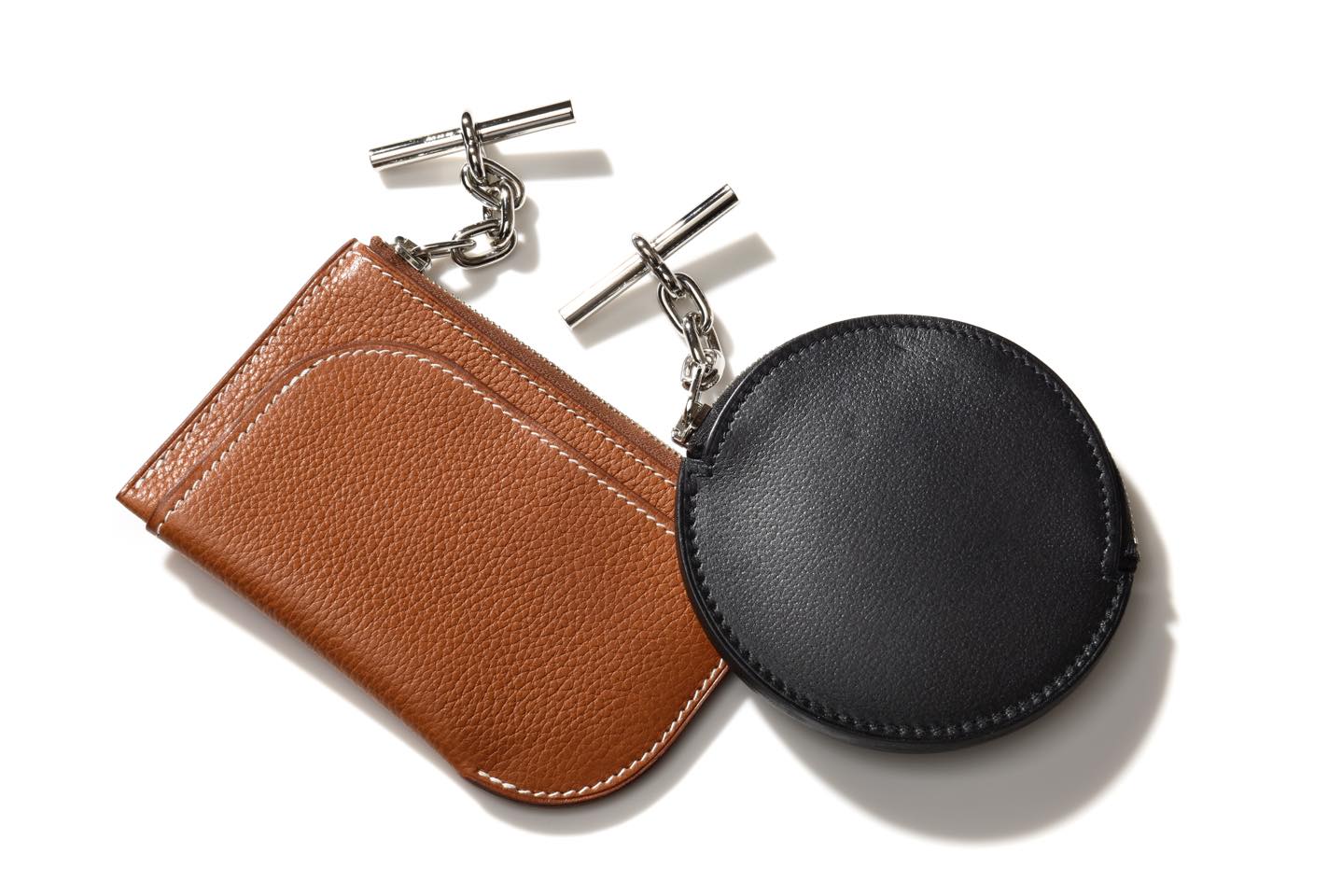 左からカードケース【W12×H8.3cm】¥148,000・小銭入れ【9×9cm】¥125,000(エルメスジャポン)